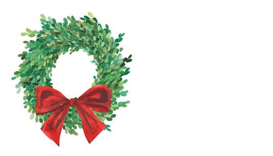 Green wreath with a red bow on a white background